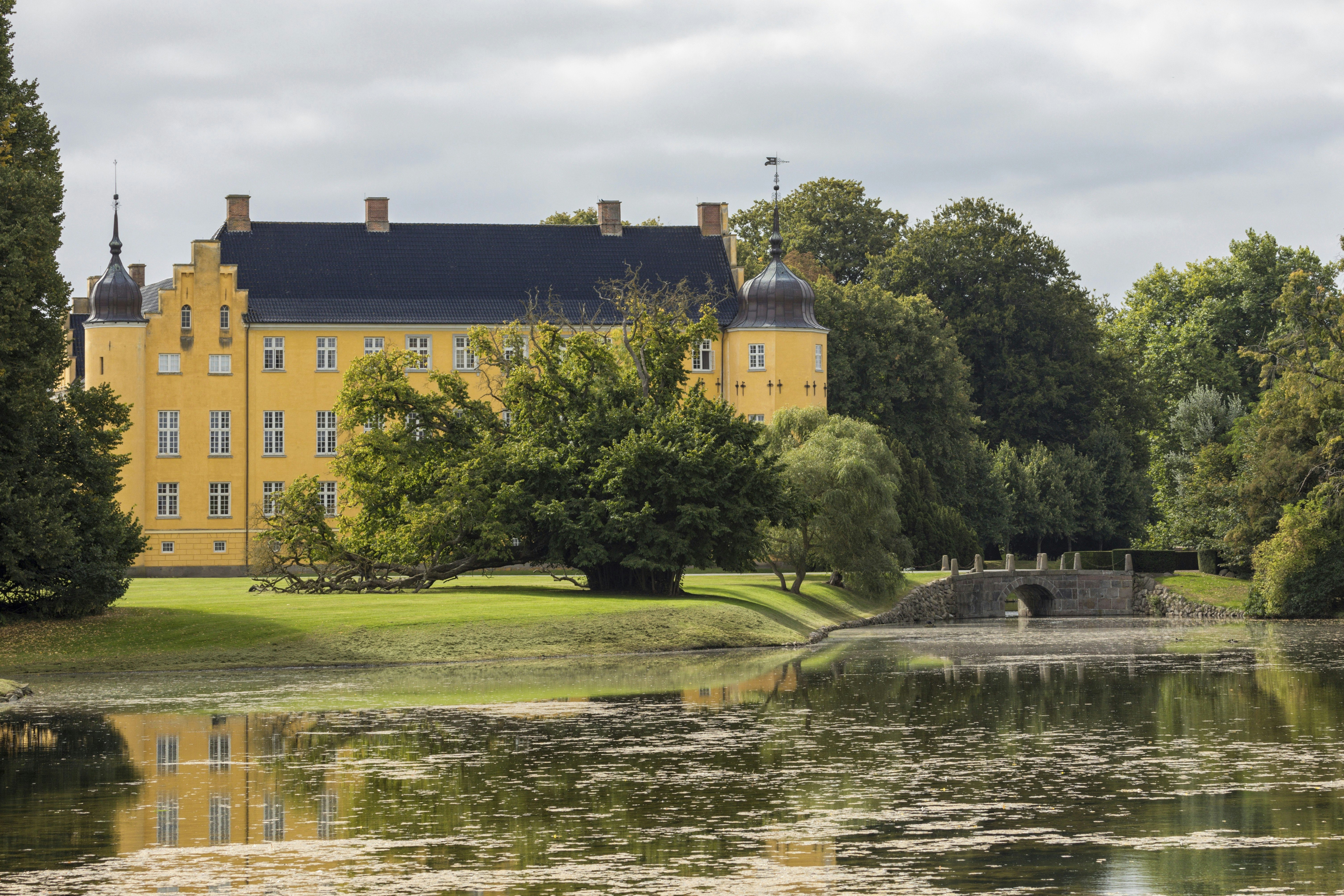 Sakskøbing, Denmark – September 13, 2021: Castle at Krenkerup Gods originating in 14th century, formerly owned by the Reventlows.
