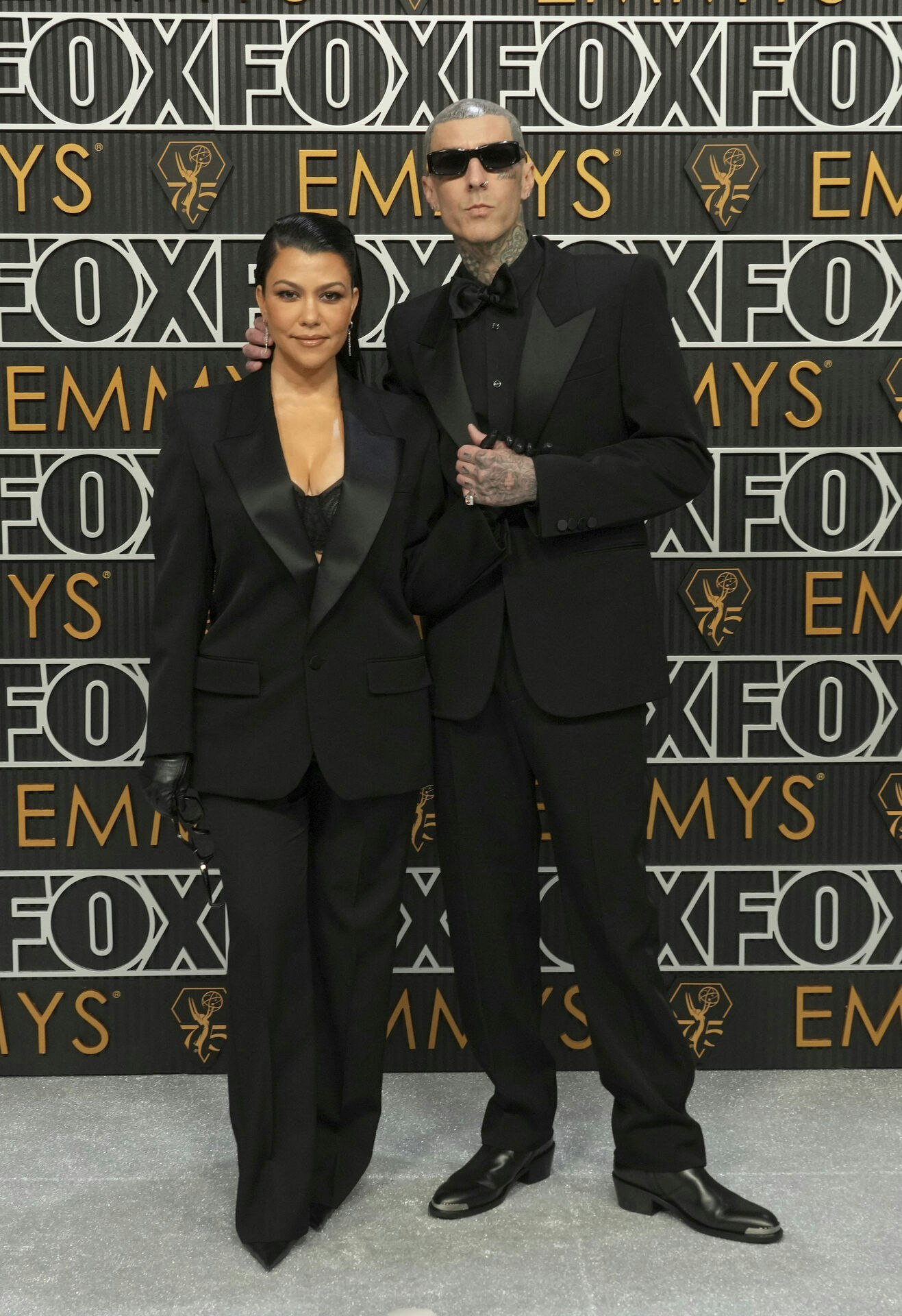 Kourtney Kardashian and Travis Barker pose for a Red Carpet portrait at the 75th Emmy Awards on Monday, Jan. 15, 2024 at the Peacock Theater in Los Angeles. (Photo by Jordan Strauss/Invision for the Television Academy/AP Images)